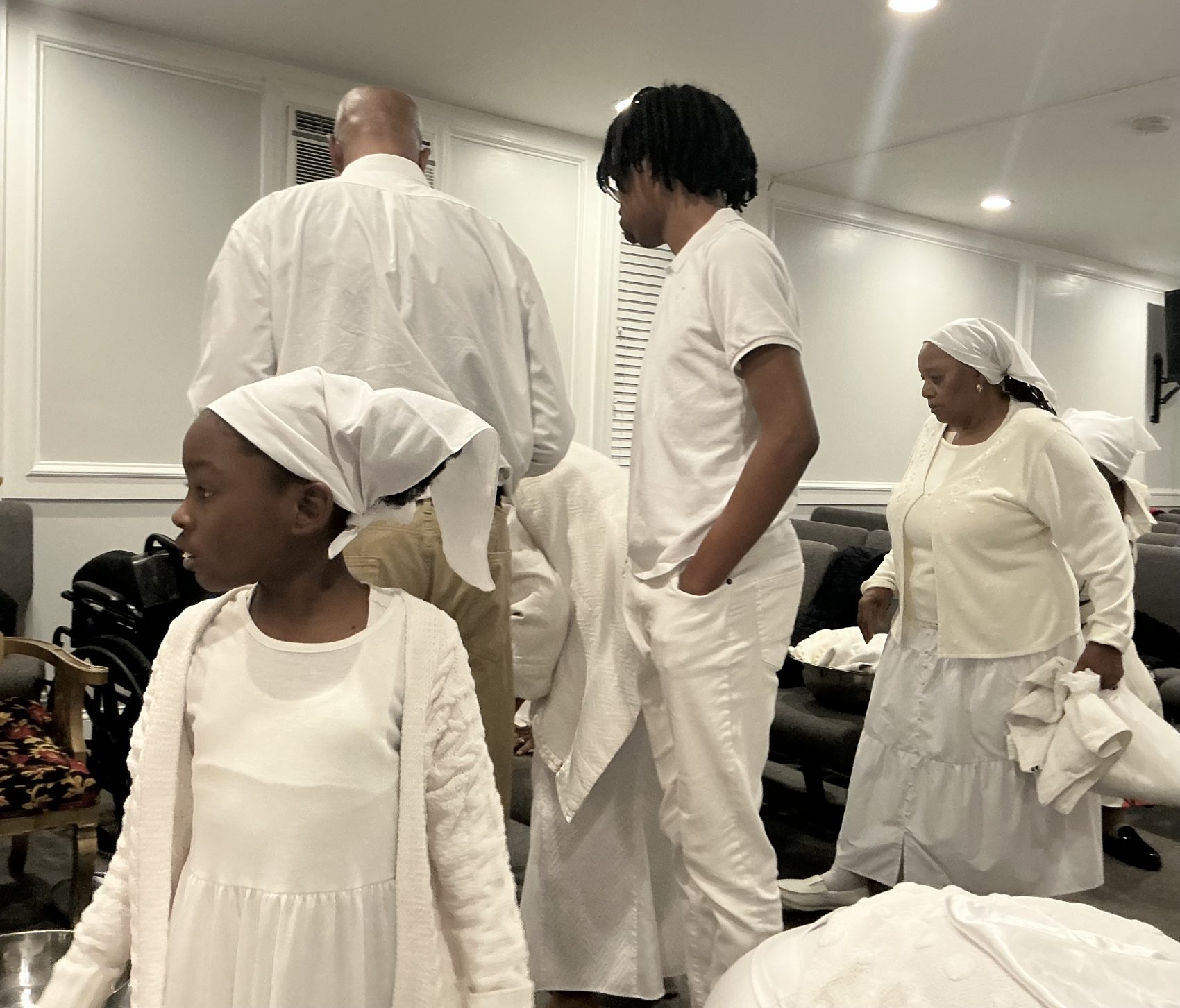 Members gathered in white for Passover service
